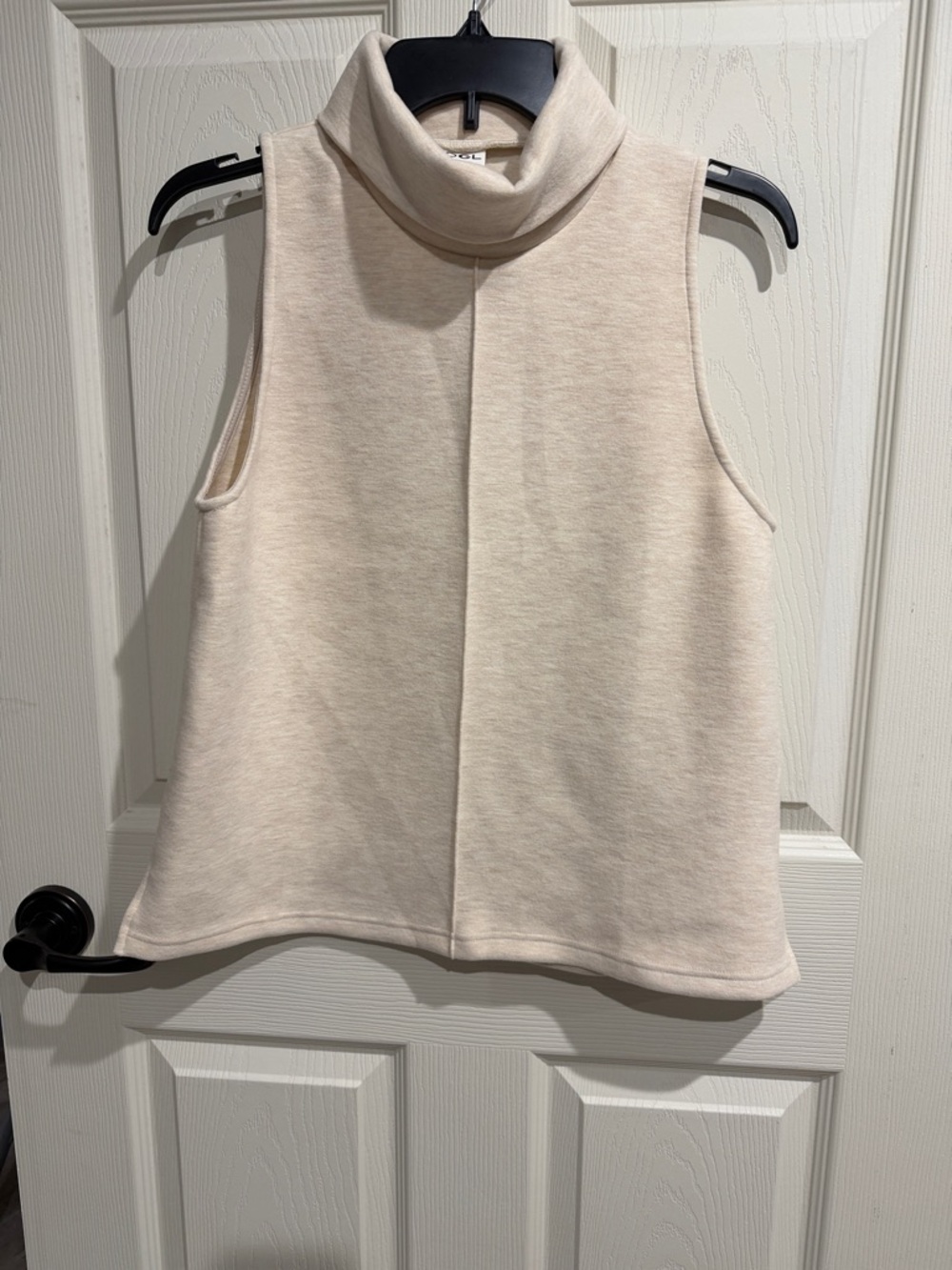OGL Sleeveless Turtleneck Camisole in Light Cream small and medium available
